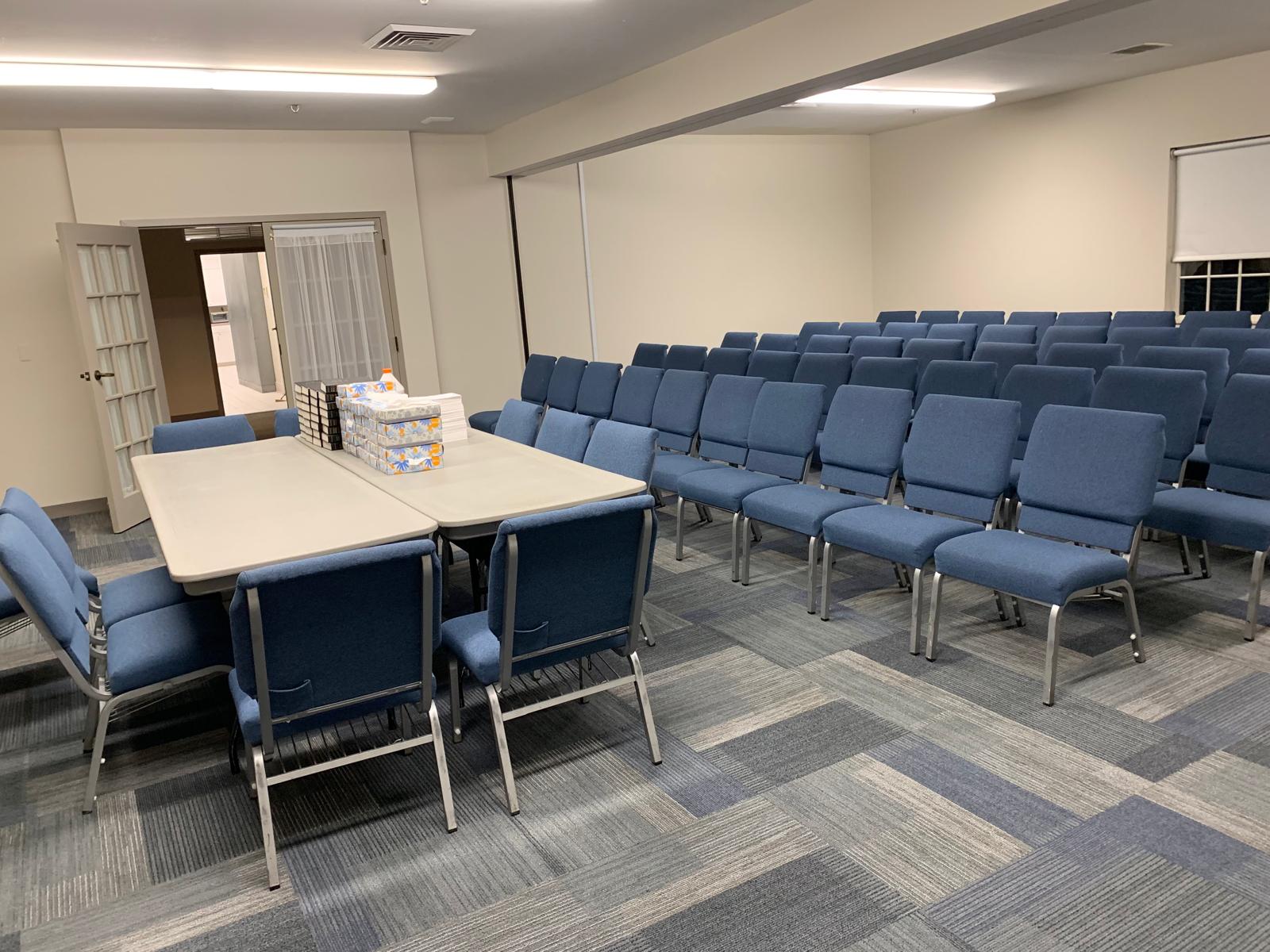 Day porter attending to a lobby area in a commercial building