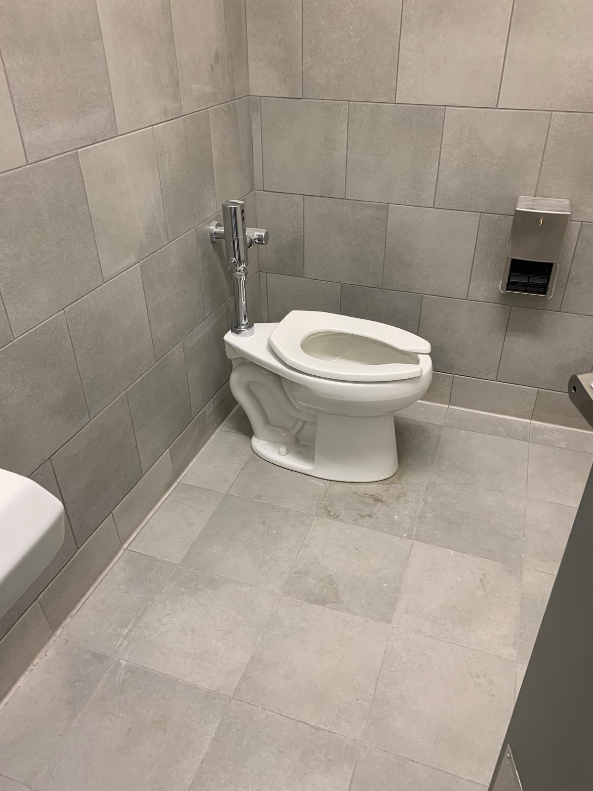 Day porter cleaning lobby with safety protocols